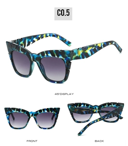 Detail view of square sunglasses with marble pattern frames and gradient purple lenses