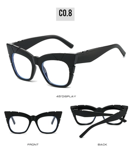 Three-angle display of black square cat-eye sunglasses with thick frames and wide temples