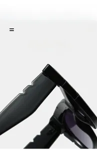 Detailed macro view of glossy black wide temples with a unique wavy edge design