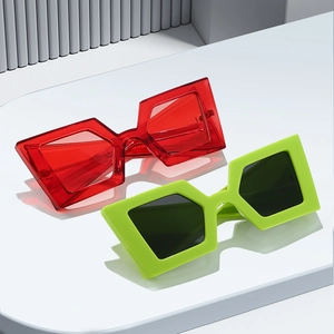 Oversized geometric sunglasses with thick frames in red and neon green for trendy street style