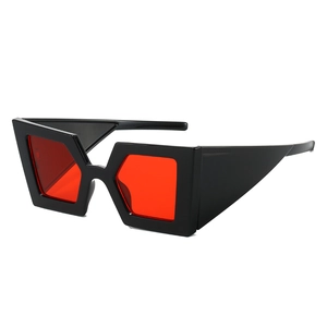 Modern thick frame oversized sunglasses with red tinted lenses and geometric design