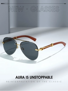 Close-up of pilot sunglasses with wood grain temples and refined golden metal joints