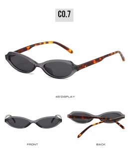 Three-angle view of vintage oval sunglasses featuring tortoiseshell temples and grey frame