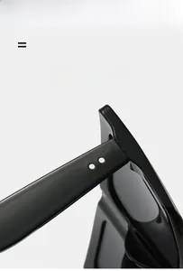 Macro shot of silver metal hinges and rivets on black square frame sunglasses