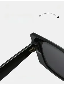Macro detail of high-quality metal hinge and inner temple specs on square black sunglasses