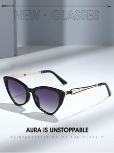 Detail of cat eye sunglasses with purple gradient lenses and gold cutout metal temples