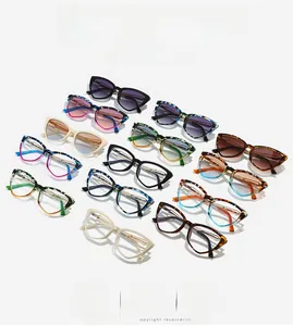 Detailed overhead view of premium cat-eye frames in assorted colors with metal hinge accents