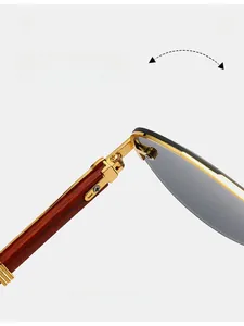 Detail of durable gold metal hinge and wood texture temples on rimless pilot sunglasses