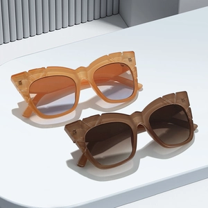 Fashionable square frame sunglasses in amber and dark brown with bold geometric wide temples