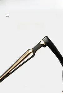 Detailed close-up of premium black and gold eyeglass temple showing high-quality hinges