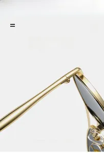 Detail of metal aviator sunglasses hinges with lightweight elastic frames in gold