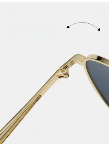 Close-up of a durable gold metal hinge on stylish double-bridge aviator sunglasses