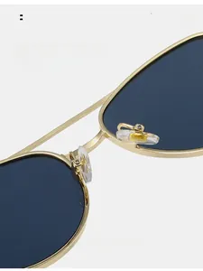Close-up of comfortable silicone nose pads on gold metal aviator sunglasses
