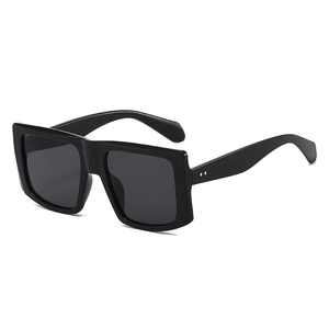 Retro oversized square sunglasses with thick black frame and dark grey lenses for street style