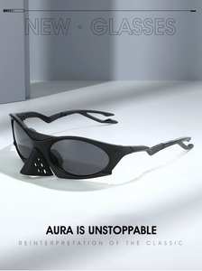 Detail of black futuristic sports sunglasses featuring unique perforated nose guard design
