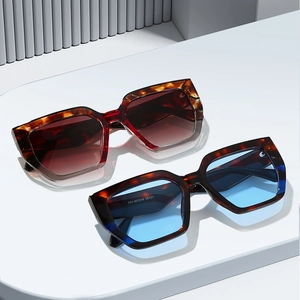 Stylish oversized geometric sunglasses with tortoiseshell frames and gradient lenses