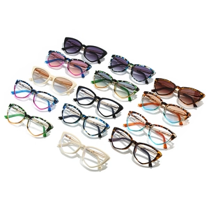 Collection of cat eye sunglasses and frames in assorted gradient colors and patterns