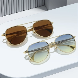 Classic gold metal pilot sunglasses with brown and blue-yellow gradient lenses in a set