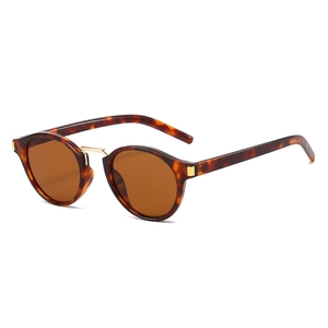 Retro round tortoise shell sunglasses with gold metal bridge shown in a 45-degree angle view