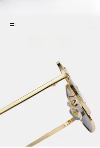 Detail view of gold metal sunglasses frame with lightweight nose pads and temples