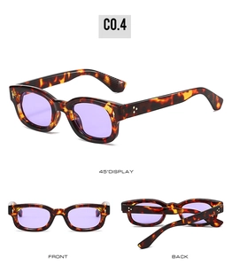 Detail view of retro square tortoise sunglasses with purple lenses and silver rivet accents
