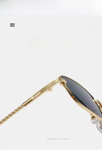 Detail of golden metal sunglasses with spiral temple design and super elastic frame