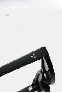 Detail of square black sunglasses frame featuring three gold star metal rivets on temples