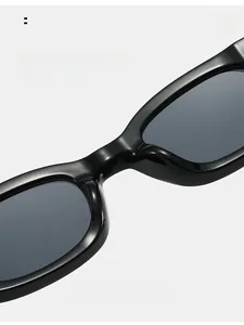 Detail of integrated thickened nose pads on retro black rectangular sunglasses