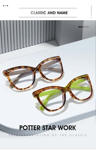 Detailed view of tortoiseshell cat-eye glasses frames with neon green temples on a stand
