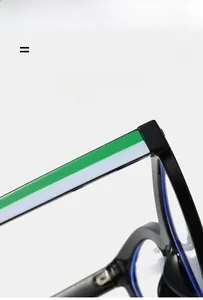 Detail of lightweight black glasses frames featuring distinctive green and white stripe temples