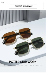 Close-up of classic pilot sunglasses with double bridge metal frame and tinted lenses