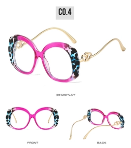 Detailed views of round fashion glasses frames with leopard print and golden heart temples