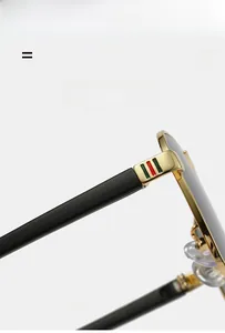 Detailed close-up of lightweight pilot sunglasses featuring metal hinges and green-red stripes