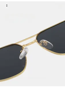 Close-up of soft silicone nose pads on lightweight gold metal aviator sunglasses