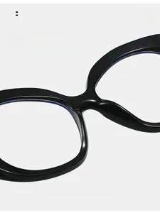Macro detail of ergonomic one-piece nose pads on glossy black anti-blue light glasses