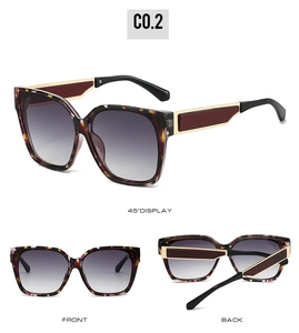 Detail view of square tortoiseshell sunglasses with gradient lenses and metal temples