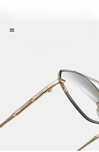 Detail view of gold metal glasses frame featuring flexible hinges and grey accents