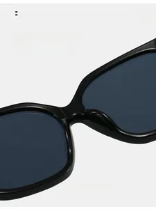 Detail of integrated nose pads on black square frame sunglasses for comfort