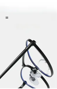 Close-up of cat-eye glasses frame detailing nose pads and flexible metal hinges
