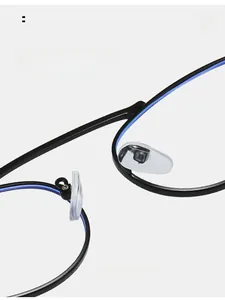 Detail of comfortable transparent silicone nose pads on stylish black metal eyeglass frames