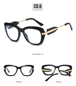 Three-view display of black oversized sunglasses with golden metal arrow hinges