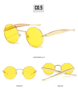 Vue détaillée des lunettes de soleil ovales en métal doré avec verres jaunes sous plusieurs angles