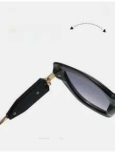 Detail of durable gold metal hinge on premium black acetate frame sunglasses