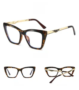 Detail view of tortoiseshell cat eye glasses with elegant gold hollow metal temples