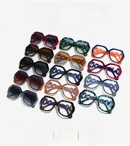 Detail of oversized hexagonal sunglasses featuring hollow ring temple design in various colors