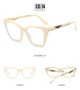 Detail view of cat-eye frames with gold metal temples and decorative triangle accents