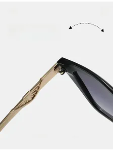 Close-up of durable golden metal hinges with geometric relief on black sunglasses