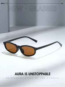 Detail view of stylish black frame sunglasses with amber lenses and sleek temples