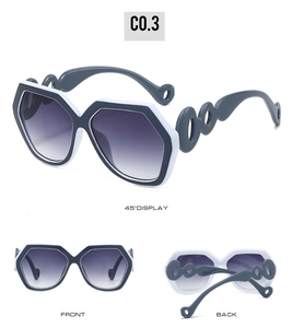 Three views of trendy hexagonal oversized sunglasses with wavy hollow temple design