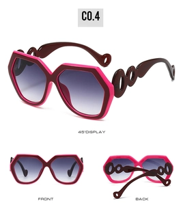 Detailed views of rose pink and burgundy geometric oversized sunglasses with chain temples